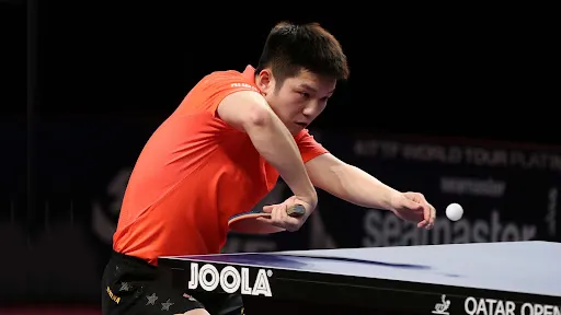 Table tennis coach feeding multi ball