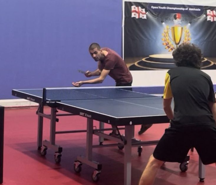 Grigoli playing a match at a tournament hall